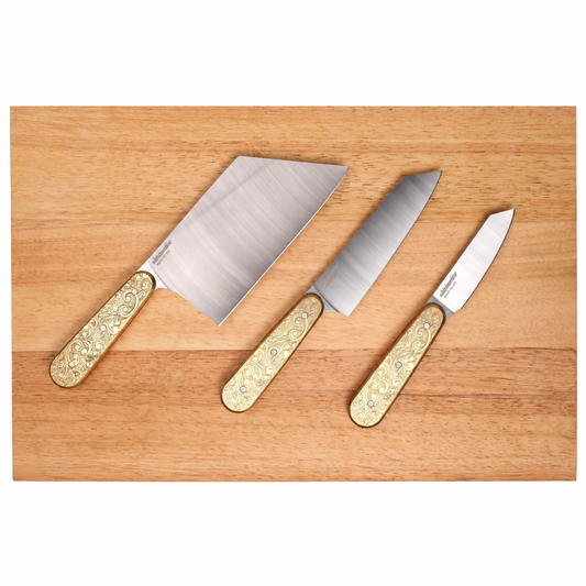 Doubloon knife set on plain cutting board