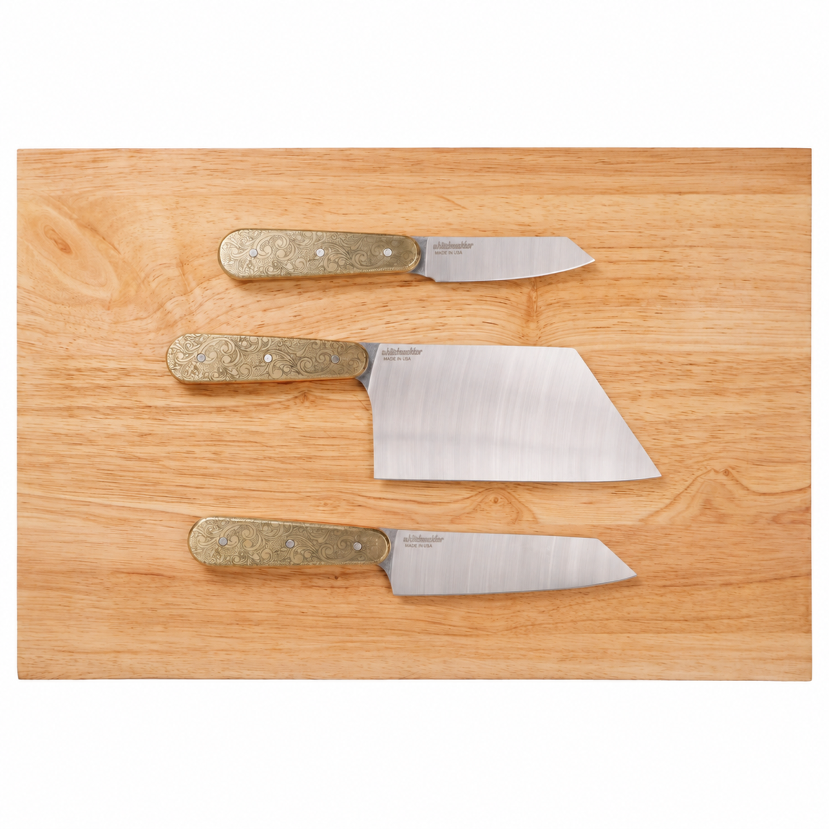 Doubloon knife set on plain cutting board