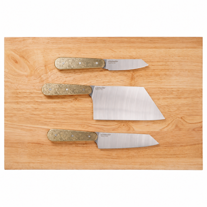 Doubloon knife set on plain cutting board
